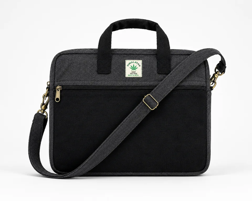 Black bag detail showing the woven hemp-and-cotton texture, stitching and Made in Nepal label